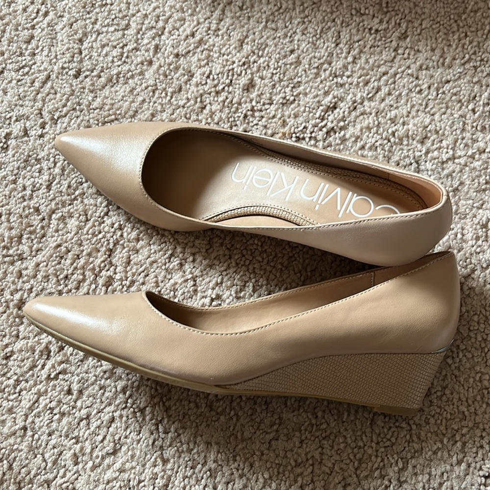 Brand new. Calvin klein wedges. Comes with original box